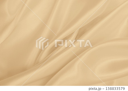 Smooth elegant golden silk or satin luxury cloth texture as wedding background. Luxurious background design. In Sepia toned. Retro style Smooth elegant golden silk or satin luxury cloth texture as wedding background. Luxurious background design. In Sepia toned. Retro style 138833579