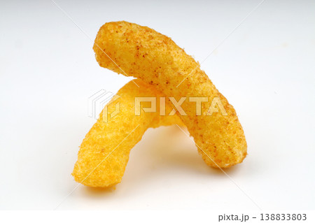 Puffed corn peanuts snacks isolated on white background. Puffed corn peanuts snacks isolated on white background. 138833803