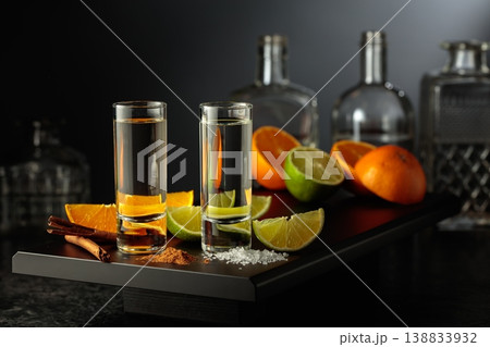 Tequila shots with lime, salt, orange, and cinnamon. Tequila shots with lime, salt, orange, and cinnamon. 138833932