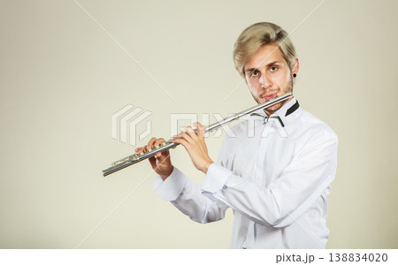 Flute music playing flutist musician performer Flute music playing flutist musician performer 138834020