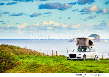 Car with roof top tent camp on sea shore 138834389