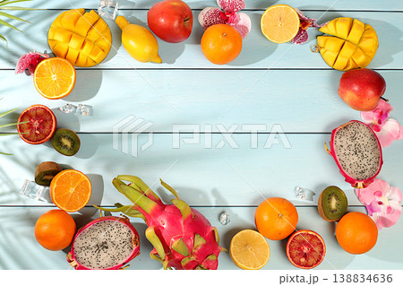 Dragon fruit, pitaya, mango, kiwi, avocado, apples, citrus and oranges on sunny table. Summer banner with tropical exotic fruits. Healthy vegan food for weight loss, advertising postcard. Dragon fruit, pitaya, mango, kiwi, avocado, apples, citrus and oranges on sunny table. Summer banner with tropical exotic fruits. Healthy vegan food for weight loss, advertising postcard. 138834636