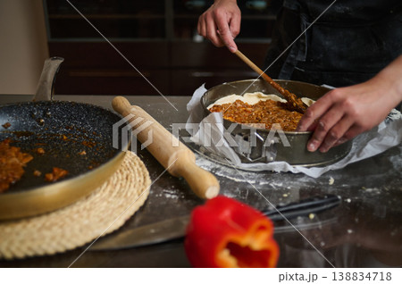 Raw lasagna with grated cheese ready for baking close up 138834718