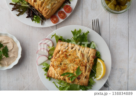 Top View Savory Stuffed Pastry with Fresh Salad Top View Savory Stuffed Pastry with Fresh Salad 138834889