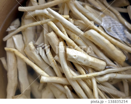 Peeled Horseradish Roots Soaking in Water for Preparation and Cooking at Home Kitchen Peeled Horseradish Roots Soaking in Water for Preparation and Cooking at Home Kitchen 138835254