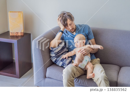 Tired father falling asleep on couch while holding baby at home. Exhausted dad struggling with lack of sleep and childcare. Parenting fatigue, newborn care and real family life concept Tired father falling asleep on couch while holding baby at home. Exhausted dad struggling with lack of sleep and childcare. Parenting fatigue, newborn care and real family life concept 138835562