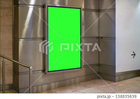 Advertising board display green mockup on steel wall tiles at underground passage Advertising board display green mockup on steel wall tiles at underground passage 138835639