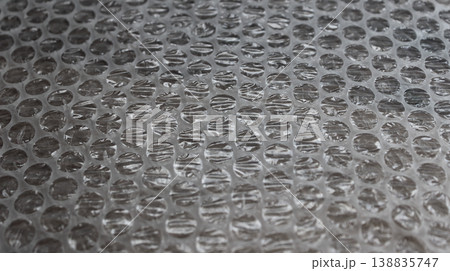 Used Bubble Wrap Sheet Angle View Textured Stock Photo. Package Material Backgrounds 138835747
