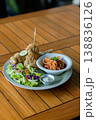 Western Style Fried Chicken with Pasta and Salad on Wooden Table 138836126