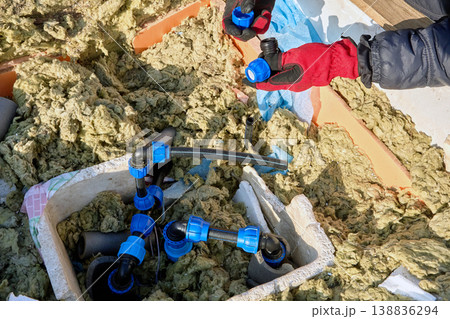 Repair of water supply system of HDPE pipes in artesian well pit. Repair of water supply system of HDPE pipes in artesian well pit. 138836294