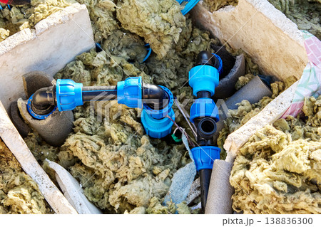 HDPE piping in artesian well pit during renovation. 138836300