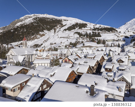 Flight over the famous village of Andermatt in Switzerland in winter - aerial photography 138836312