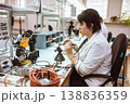 Women make soldering of radio components to electronic boards. Plant for the production of electronic equipment. 138836359