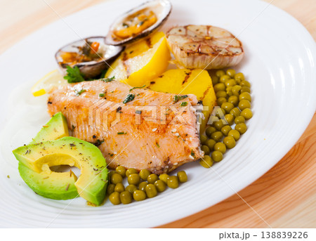 Baked trout fillet with vegetables and dog cockles Baked trout fillet with vegetables and dog cockles 138839226