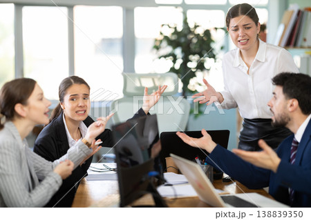 Group of men and women arguing loudly in office Group of men and women arguing loudly in office 138839350