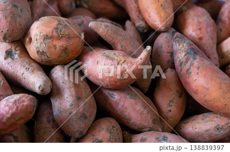 Raw organic sweet potato, food background Raw organic sweet potato, food background 138839397
