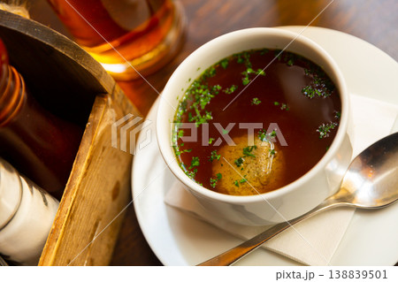 Dish of Austrian cuisine is homemade beef soup with liver meatballs Dish of Austrian cuisine is homemade beef soup with liver meatballs 138839501