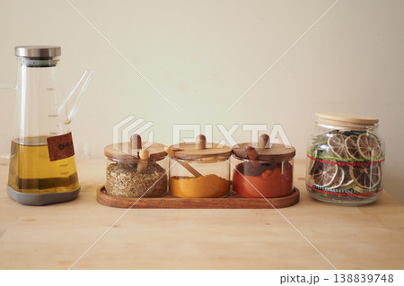 Spices and oil arranged on a kitchen counter 138839748