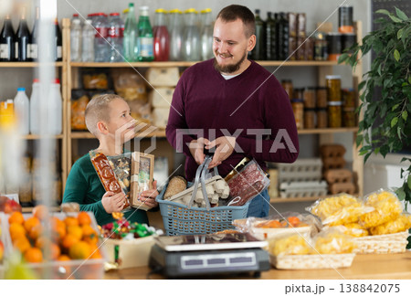 Father and son shopping together in grocery store Father and son shopping together in grocery store 138842075