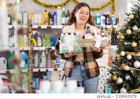 On New Year Eve, woman choose and buy cosmetics gift set 138842079