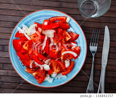 Vegetarian tomatoe salad with onion and olive oil 138842157