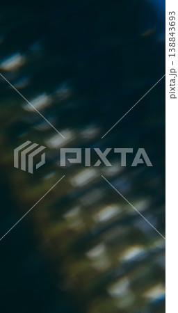 Prism blur glow. Leak flare. Kaleidoscopic pattern light reflection. Blue gray color crystal lens texture on black abstract background. 138843693