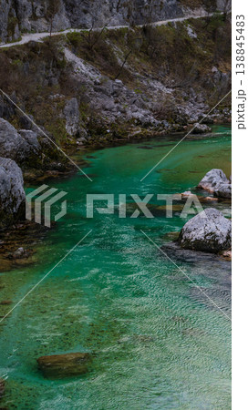 Beautiful turquoise mountain river. Soca (Isonzo) river, Julian Alps of Slovenia. Popular touristic destination. Beautiful turquoise mountain river. Soca (Isonzo) river, Julian Alps of Slovenia. Popular touristic destination. 138845483