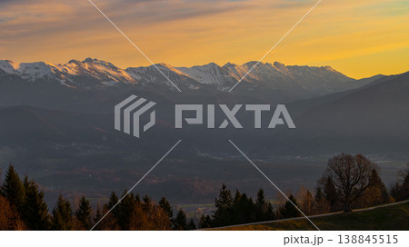 Scenic sunrise view of snow capped mountain peak in Julian Alps. Early morning atmosphere. Scenic sunrise view of snow capped mountain peak in Julian Alps. Early morning atmosphere. 138845515