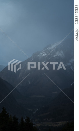 very mysterious and desolate atmosphere on a gloomy day in the mountains, dark woods with thick fog. High quality Vertical photo very mysterious and desolate atmosphere on a gloomy day in the mountains, dark woods with thick fog. High quality Vertical photo 138845528