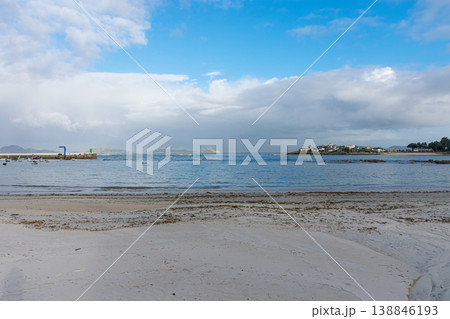 Coastal landscape of the Vigo estuary with the Canido pier and the Cies Islands under a bright blue sky today Coastal landscape of the Vigo estuary with the Canido pier and the Cies Islands under a bright blue sky today 138846193