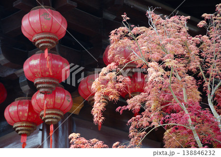 Red Lanterns and Autumn Maple Foliage at a Traditional Wooden Temple Pavilion Red Lanterns and Autumn Maple Foliage at a Traditional Wooden Temple Pavilion 138846232