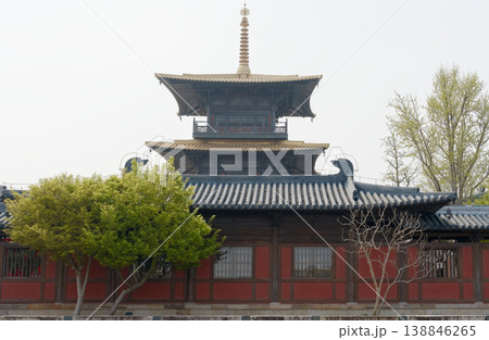 Traditional Pagoda Temple With Tiled Roof, Wooden Facade and Trees in Courtyard Traditional Pagoda Temple With Tiled Roof, Wooden Facade and Trees in Courtyard 138846265