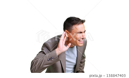 Man listening intently, hand to ear, curious 138847403
