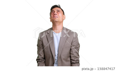 Business man expressing sadness and regret, looking up despairing Business man expressing sadness and regret, looking up despairing 138847417