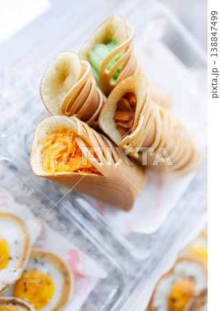 Stack of pancake roll filled with assorted filling. 138847499