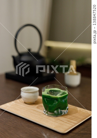 Cup of fresh matcha tea, green tea and Chasen, bamboo whisk, on wooden table. Cup of fresh matcha tea, green tea and Chasen, bamboo whisk, on wooden table. 138847520