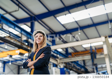 Female engineer or technician working in modern factory. Female engineer or technician working in modern factory. 138850184