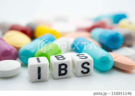 IBS Irritable bowel syndrome word with pills and capsules medical drug. IBS Irritable bowel syndrome word with pills and capsules medical drug. 138851146