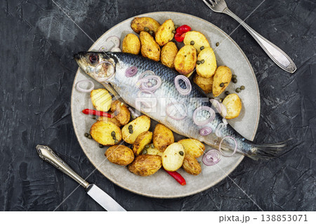 Salted herring with potatoes, onion and herbs Salted herring with potatoes, onion and herbs 138853071