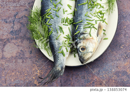Whole Salted Herring Fish with Dill on Ceramic Plate 138853074