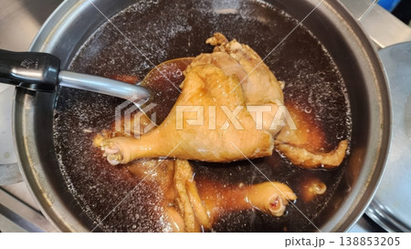 Asian Style Braised Chicken Leg in Savory Dark Soy Sauce Broth 138853205