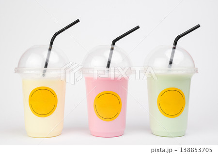 Colorful refreshing fruit drinks in clear cups with cheerful branding showcasing the joy of summer treats at a lively outdoor gathering 138853705