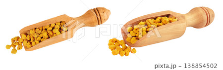 Bee pollen grains in wooden scoop isolated on white background. Top view. Flat lay Bee pollen grains in wooden scoop isolated on white background. Top view. Flat lay 138854502