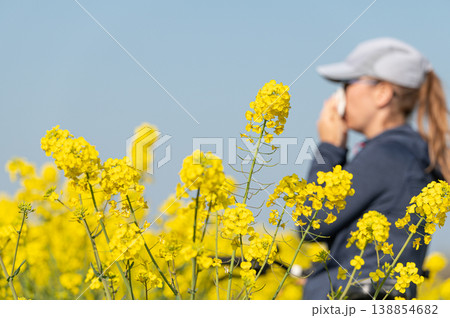 woman suffering from pollen allergy while  training outdoors 138854682