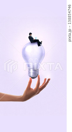 Businessman sitting on light bulb in hand representing startup funding and idea validation 138854746