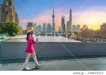 Tourists sightseeing on The Bund and Lujiazui of Shanghai, China. 138855013