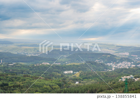 Layers of green mountains and hills in the haze during sunset. Panoramic View of Green hills and Meadow. Layers of green mountains and hills in the haze during sunset. Panoramic View of Green hills and Meadow. 138855841