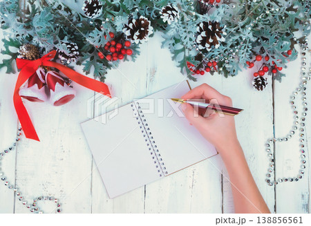Christmas wooden background with snow branch. Top view with copy space for your text Christmas wooden background with snow branch. Top view with copy space for your text 138856561