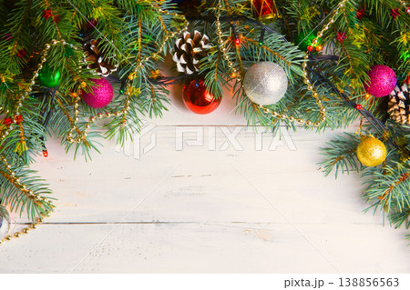 Christmas wooden background with snow branch. Top view with copy space for your text Christmas wooden background with snow branch. Top view with copy space for your text 138856563
