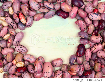 Various Types of Beans Arranged in a Circular Pattern on a Wooden Surface in a Kitchen Setting Various Types of Beans Arranged in a Circular Pattern on a Wooden Surface in a Kitchen Setting 138856571